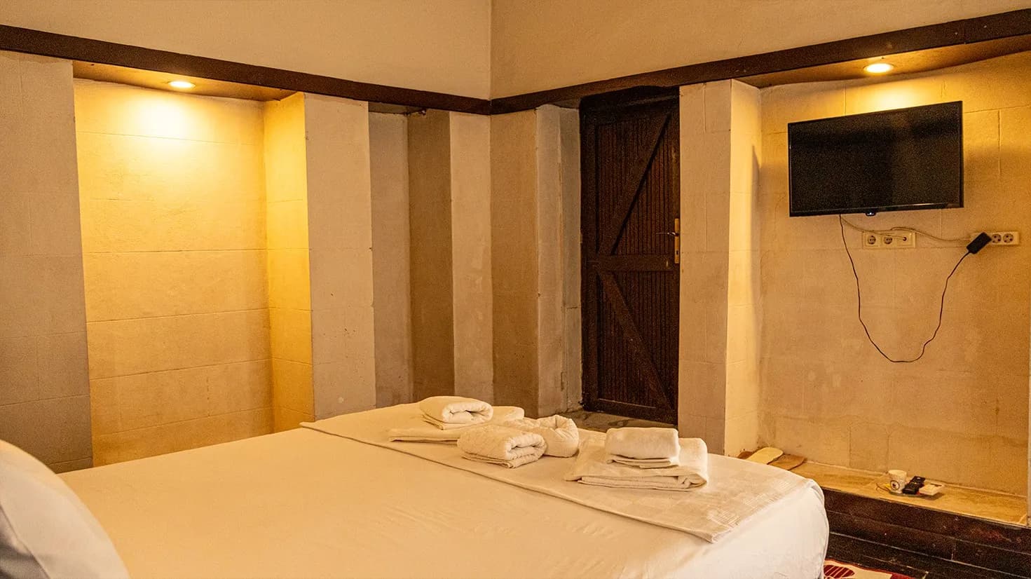 Wall-mounted TV in the Stone Niche Room